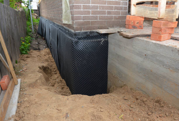 Happy homeowners after waterproofing job in Hales Corners